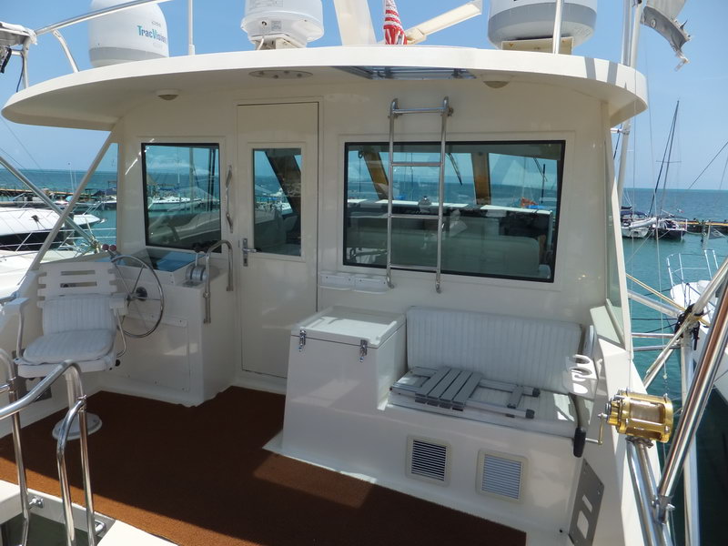 Hatteras 66 ft stern cockpit and fighting chair deck with professional trolling reels for deep-sea fishing marlin Cancun