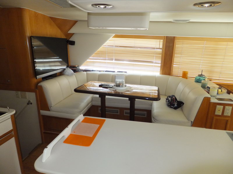 Hatteras 66 ft professional fishing yacht with trolling rod holders and deep-sea equipment for marlin sailfish charters