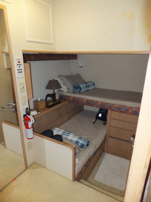 Hatteras 66 ft dining area and galley interior for overnight deep-sea fishing expeditions in Caribbean from Cancun