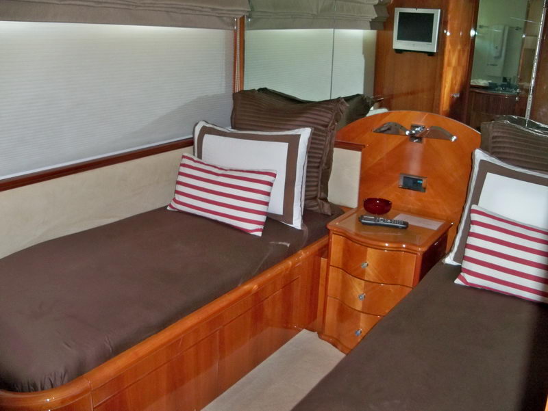 Azimut 100 ft mega yacht twin-bed cabin with cherry wood furniture and private en-suite bathroom