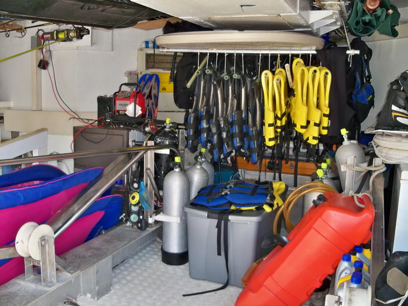 Azimut 100 ft mega yacht dive equipment garage with scuba tanks, BCDs, wetsuits, and waverunner jet skis