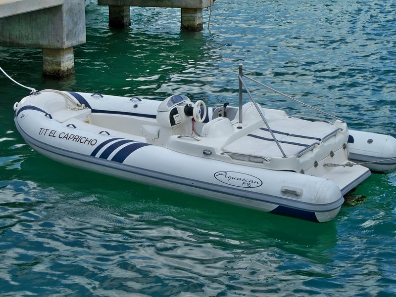 El Capricho RIB tender dinghy of the Azimut 100 ft luxury mega yacht moored in Cancun turquoise marina