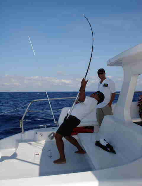 Fishing activity on Catamaya catamaran Caribbean Sea Riviera Maya group charter Puerto Aventuras