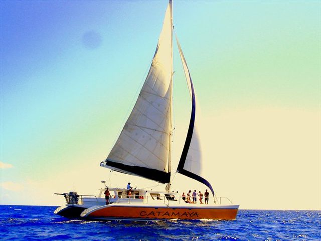 Catamaya catamaran sailing under full sails on Caribbean Sea Riviera Maya Puerto Aventuras