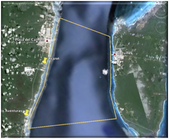 Google Earth satellite map of the channel between Playa del Carmen/Puerto Aventuras and Cozumel with a yellow-outlined snorkeling area polygon between the mainland and the island.
