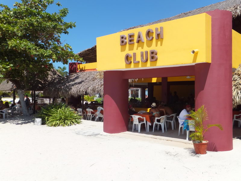 Colorful Beach Club entrance on white sand at Isla Mujeres where Samba catamaran guests from Cancun enjoy lunch and drinks