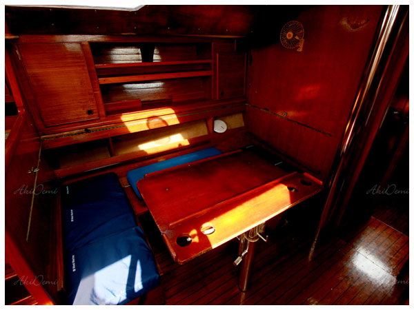 Wooden-paneled cabin interior with berths aboard Jeanneau 42 ft sailboat Xanadu, 